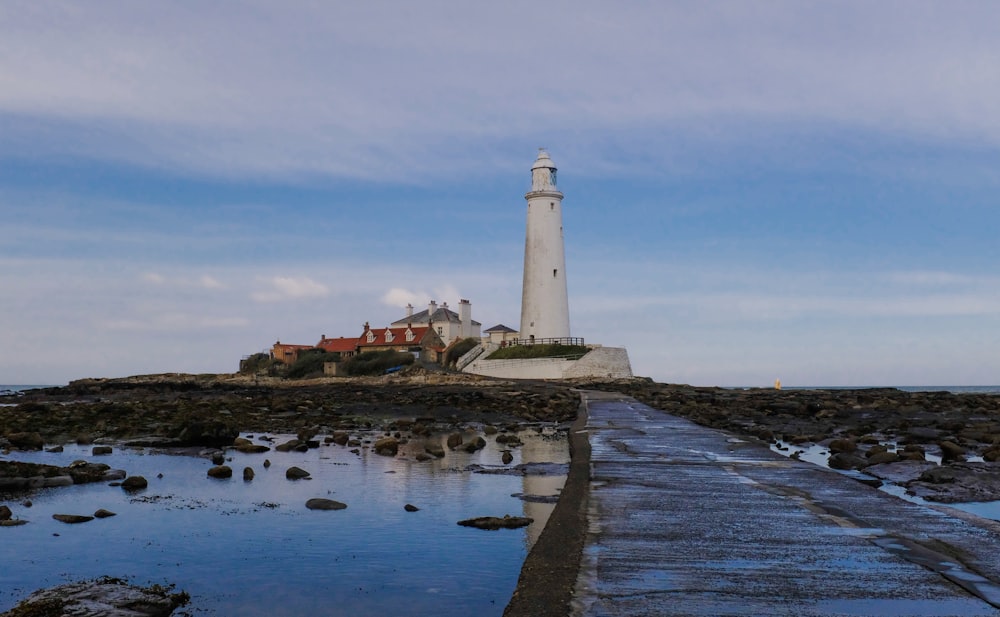 landscape photography of a white lighthouse