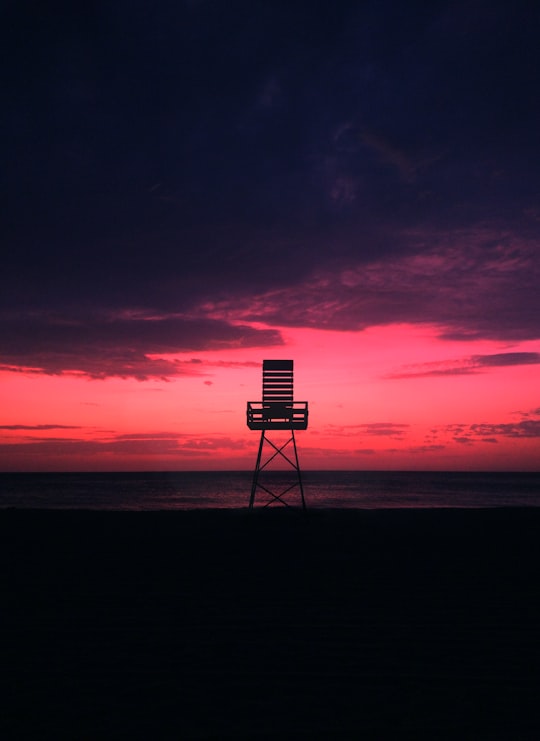 brown watch tower on shore under golden hour in Tangier Morocco