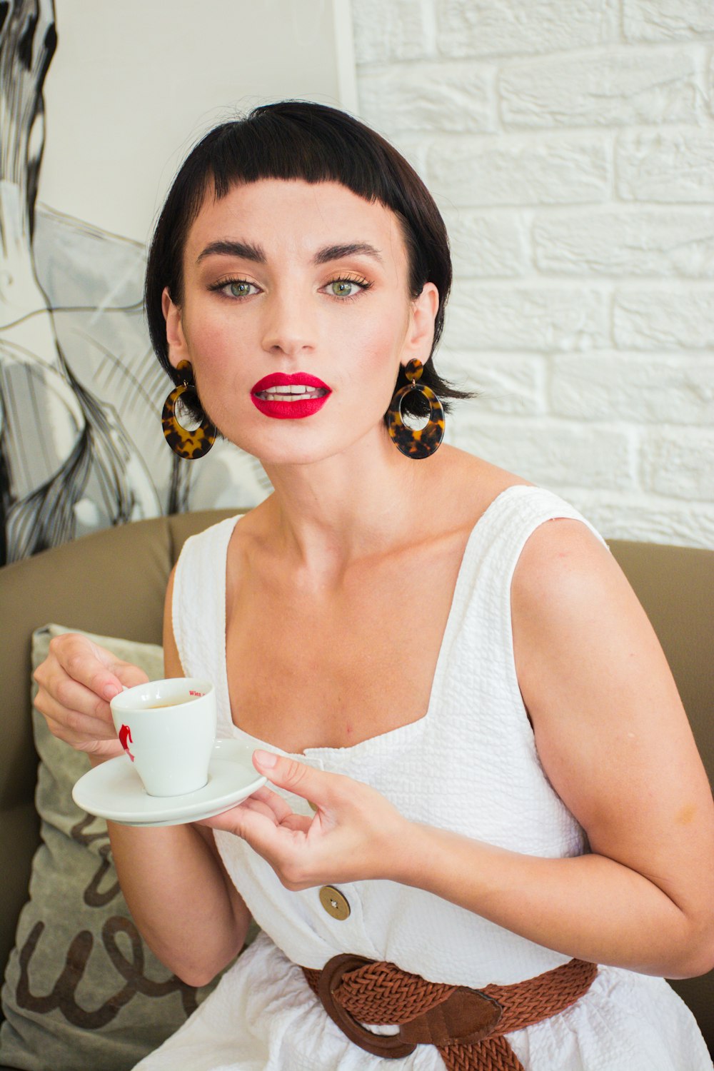 woman holding teacup