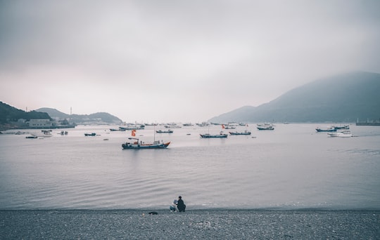 boats on body of water under cloudy sky in Zhoushan Island China