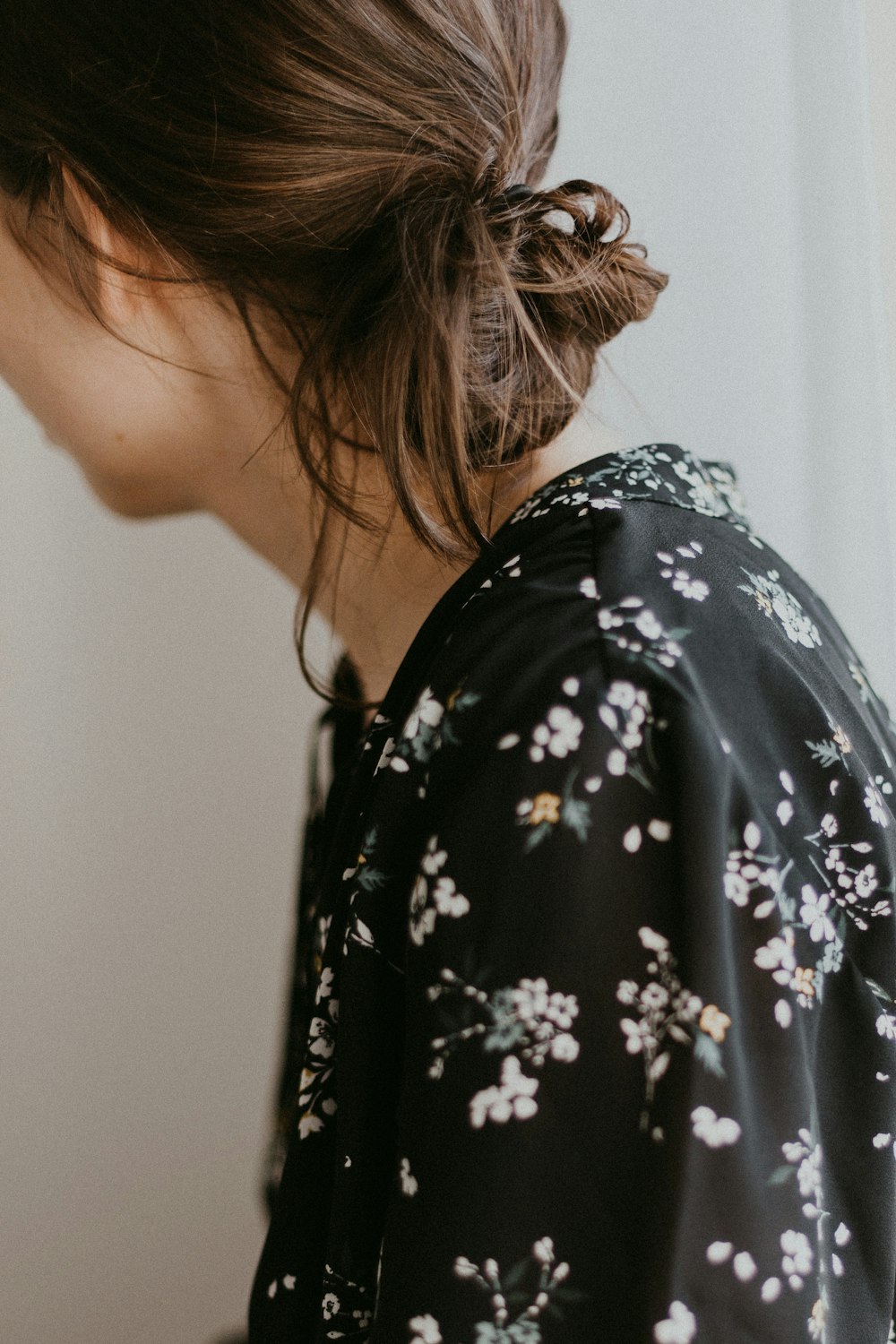 woman wearing black and white floral top