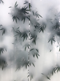 Glass panel featuring delicate laser engraving of a nature scene.