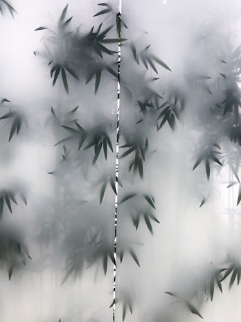 Glass panel featuring delicate laser engraving of a nature scene.