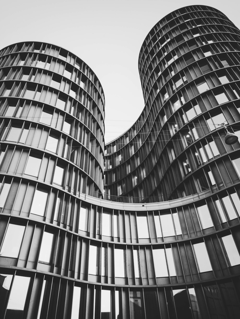 a black and white photo of two buildings