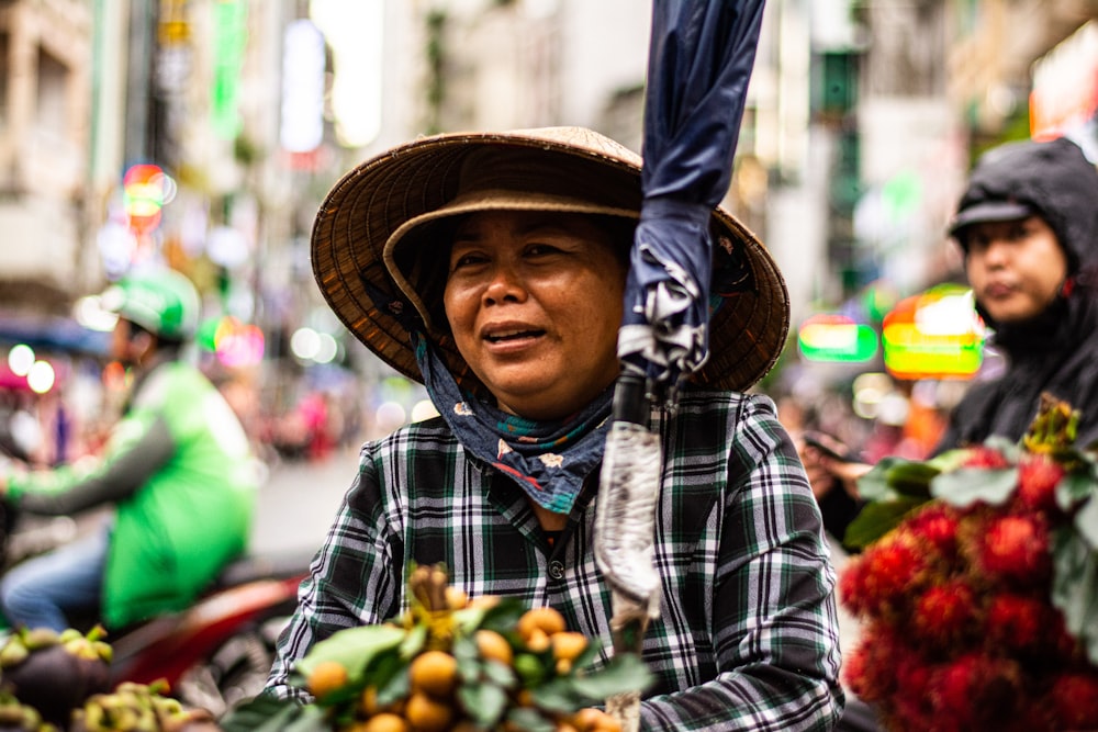 woman wearing hat near buildings