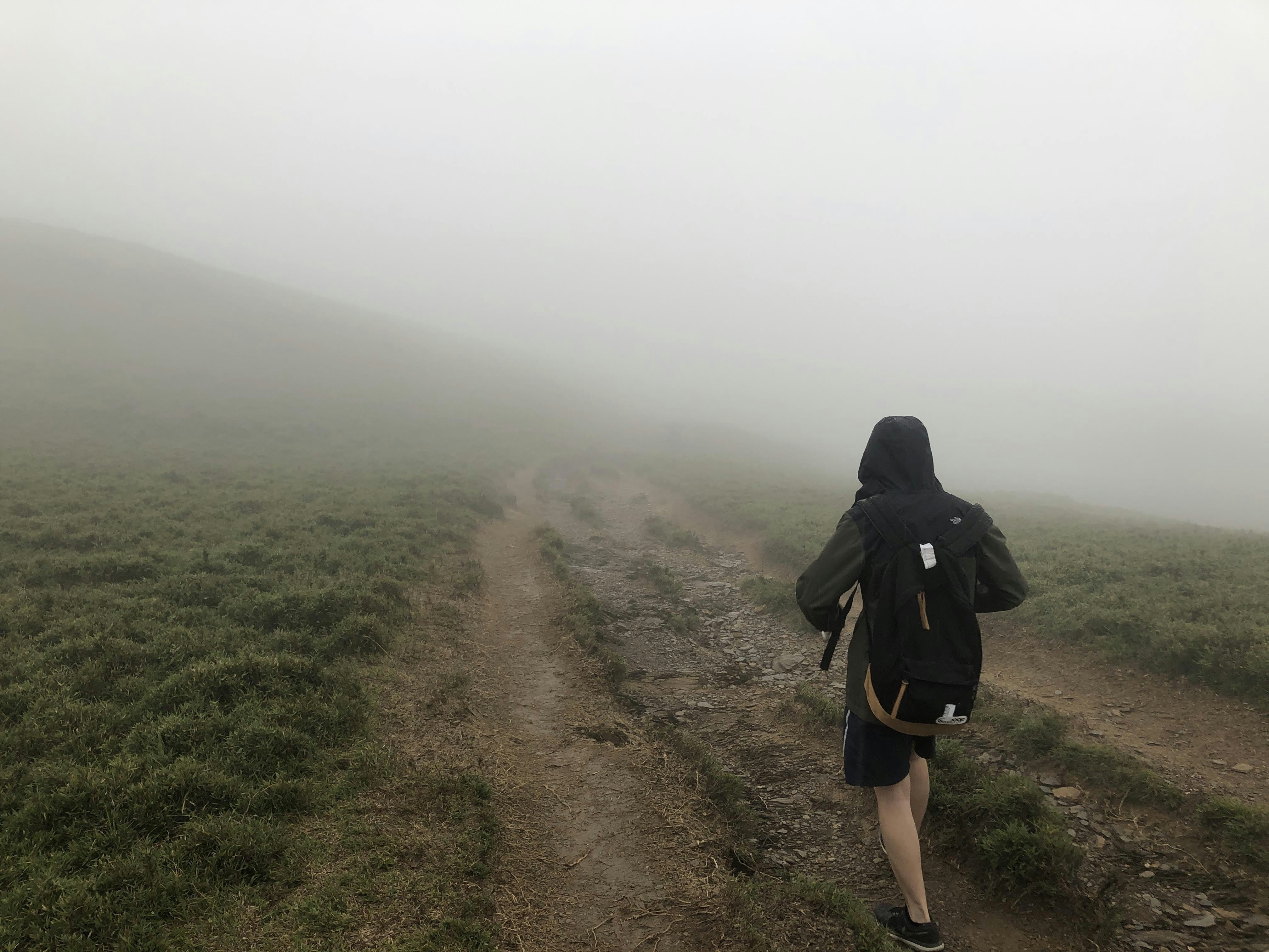 running in a fog on a mountain