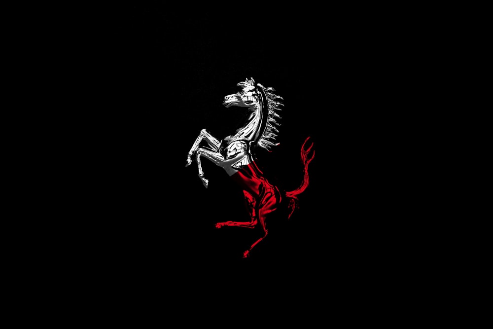 white and red horse logo