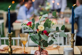 Elegant floral centerpiece featuring mint and eucalyptus greens at a wedding table.