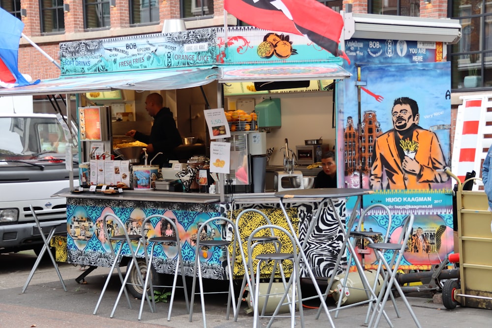 chairs near food stall with flag