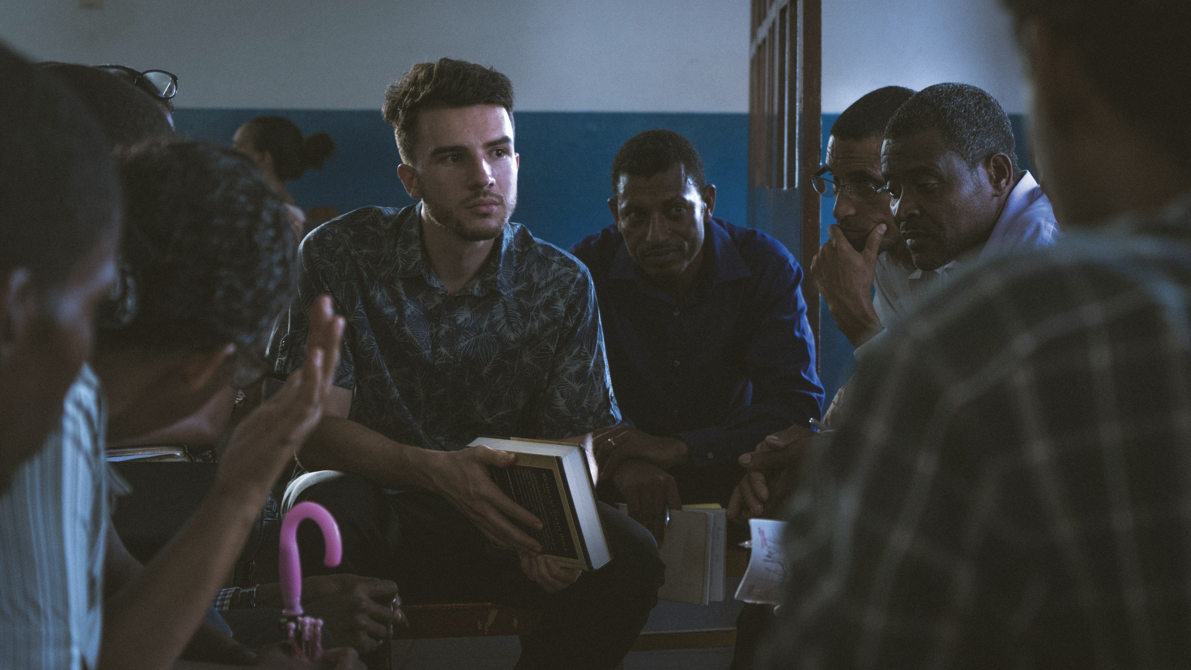 men sitting inside room