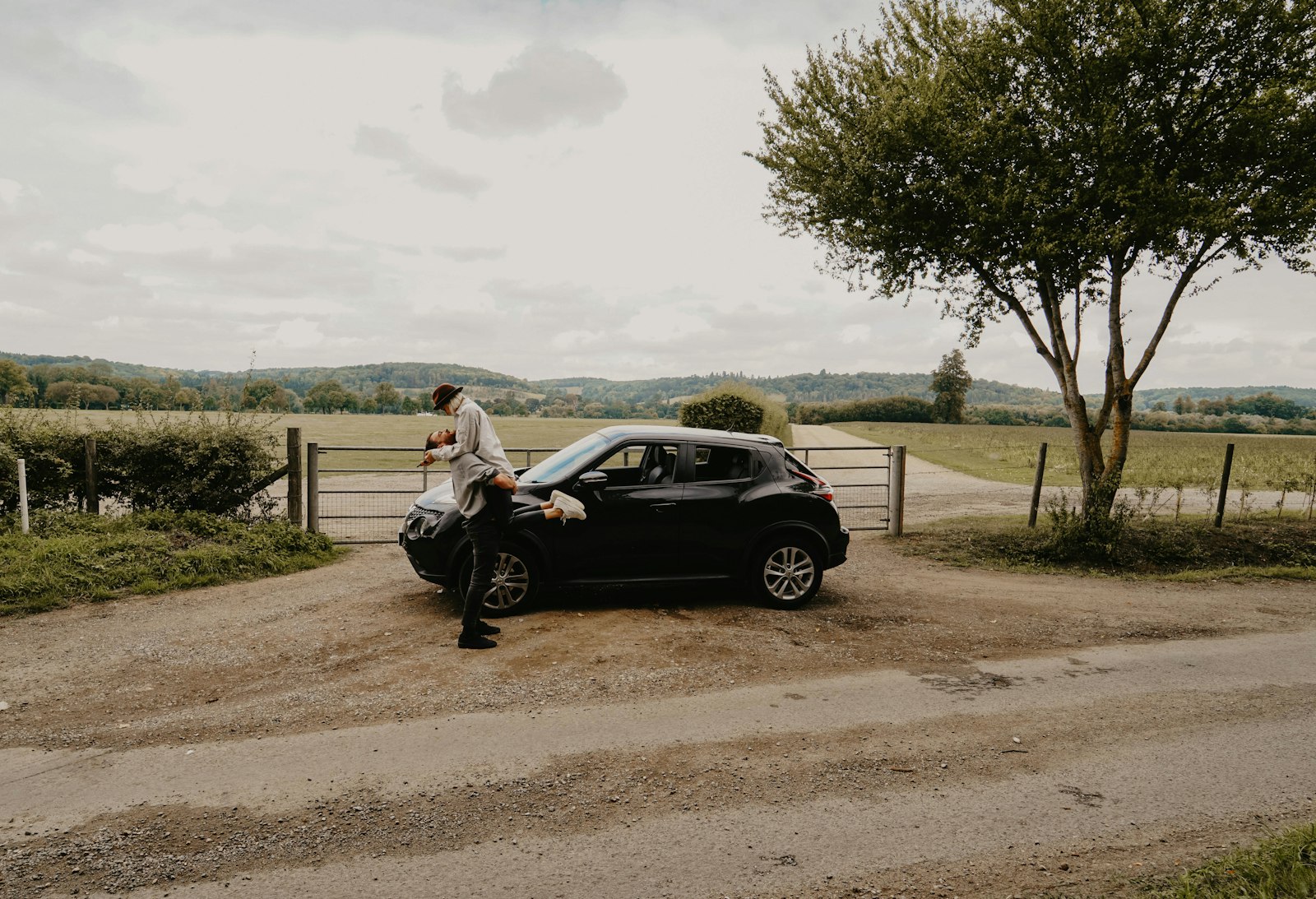 Samyang AF 14mm F2.8 FE sample photo. Man lifting woman beside photography