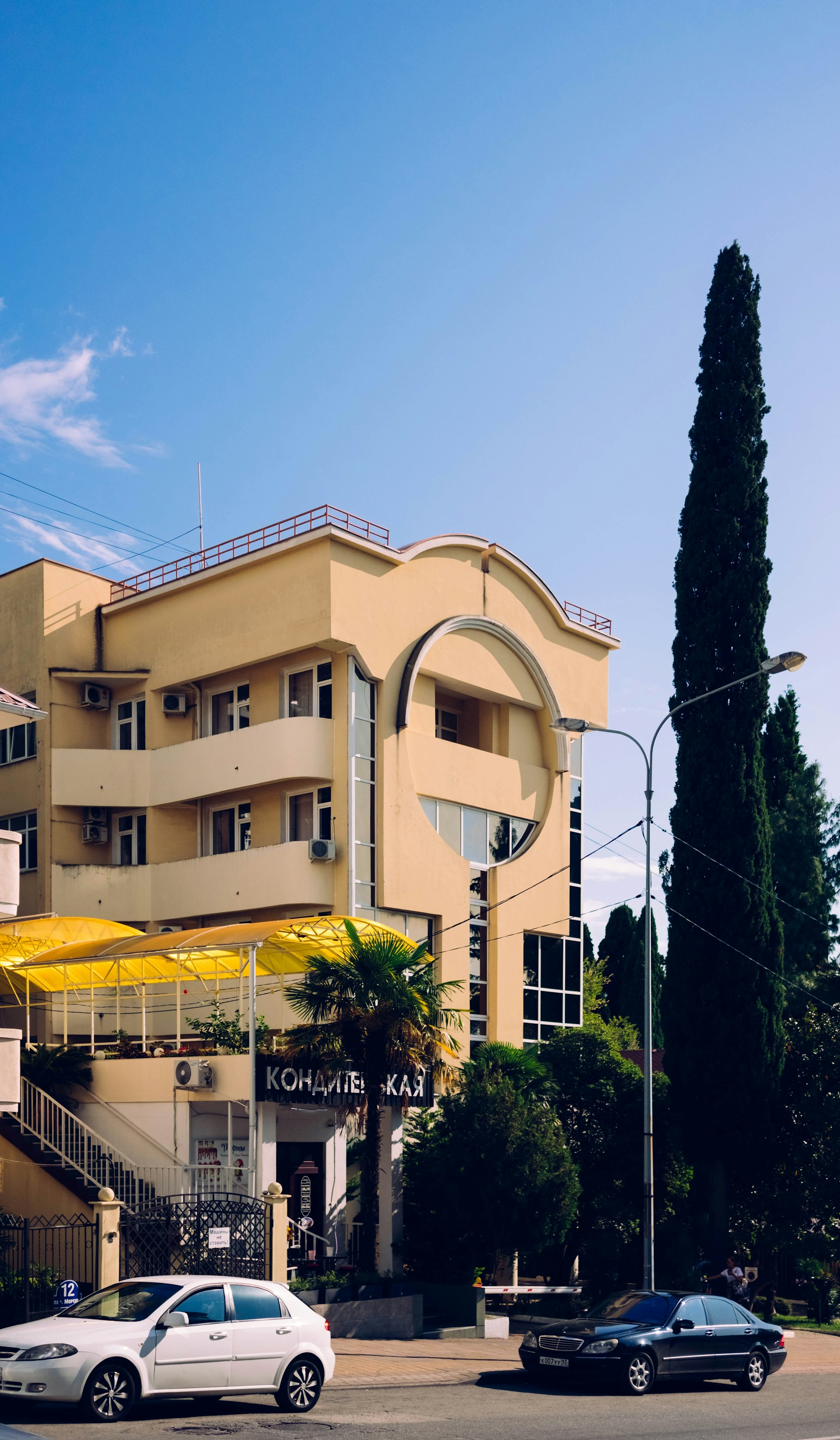 woman wearing yellow long-sleeved dress under white clouds and blue sky during daytime