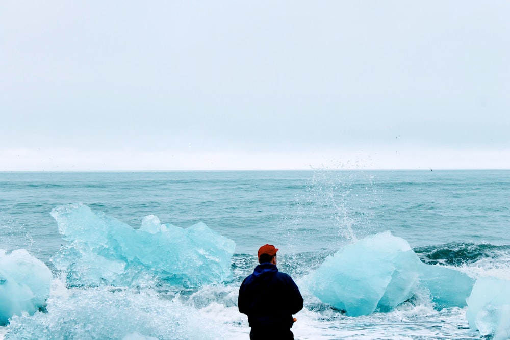 unknown person in blue jacket standing