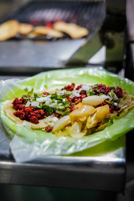 Crispy chicken tacos topped with slaw