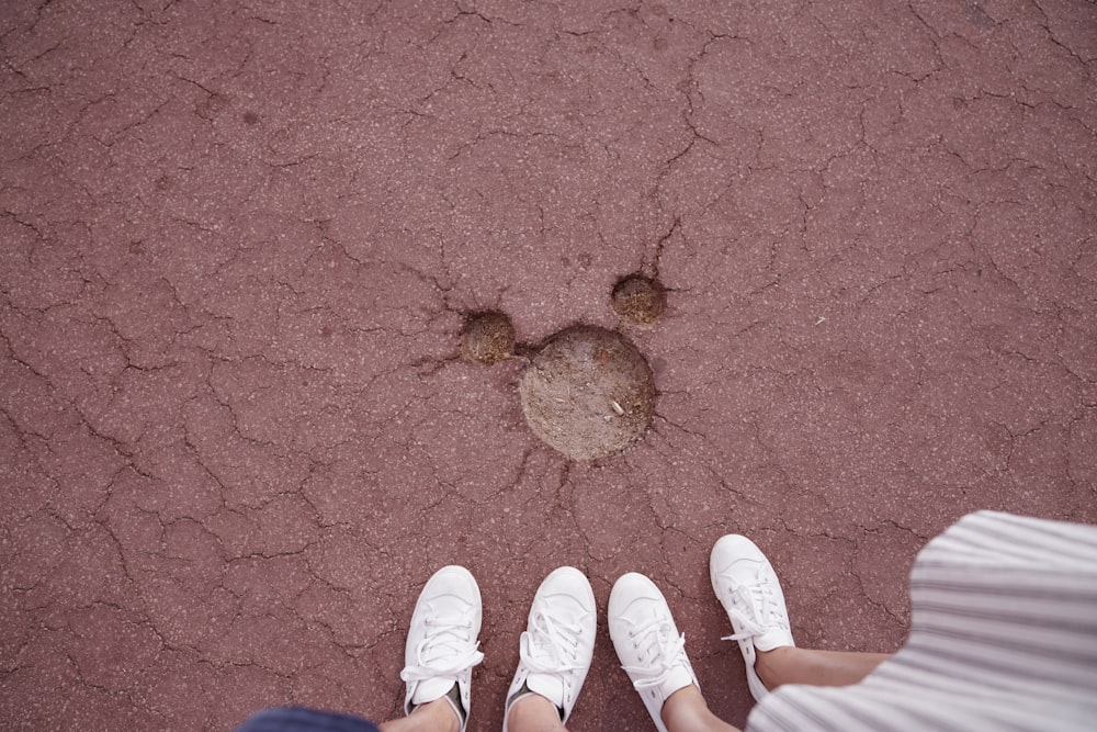 person in white shoes