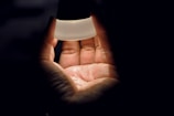 A close-up shot of hands holding a product with soft natural lighting