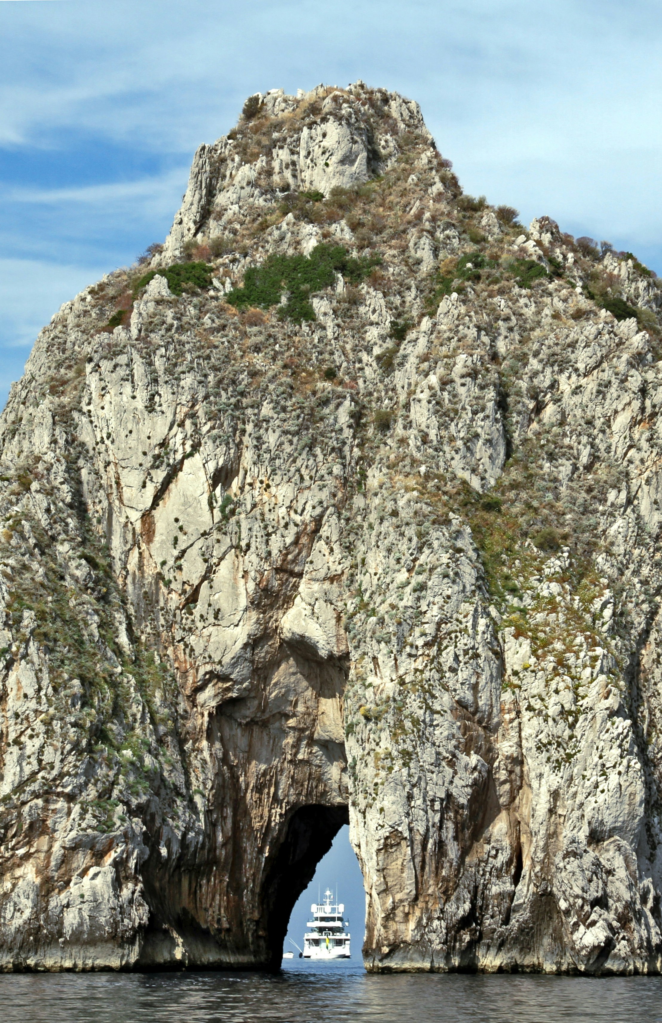 Ship waiting behind a rock, Capri, Italy, June 2015