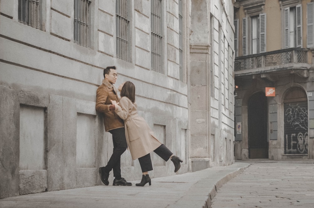 man and woman standing outdoors