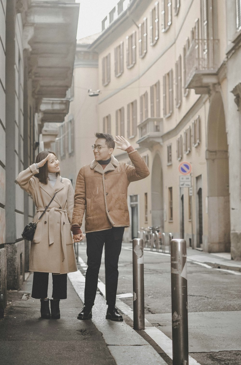 man and woman standing outdoors