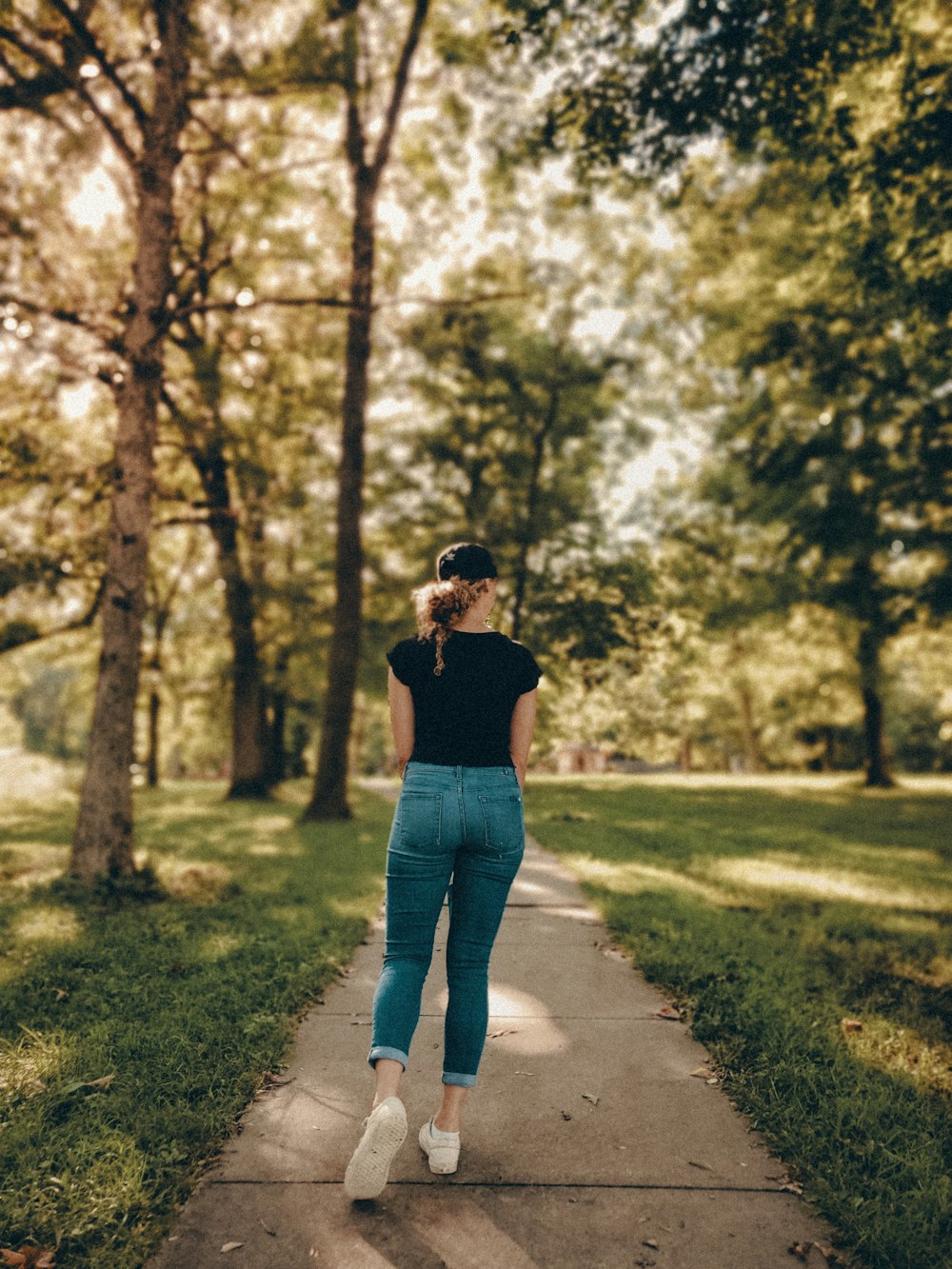 woman walking on the pathway