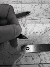 A detailed map being studied by a surveyor in Casablanca office.