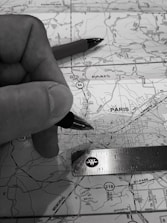 Image of a professional consulting with clients over transport route plans.