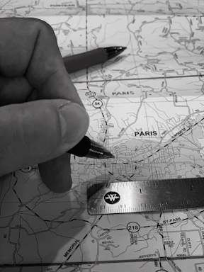 A detailed map being studied by a surveyor in Casablanca office.