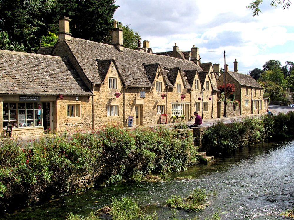 brown concrete houses beside river