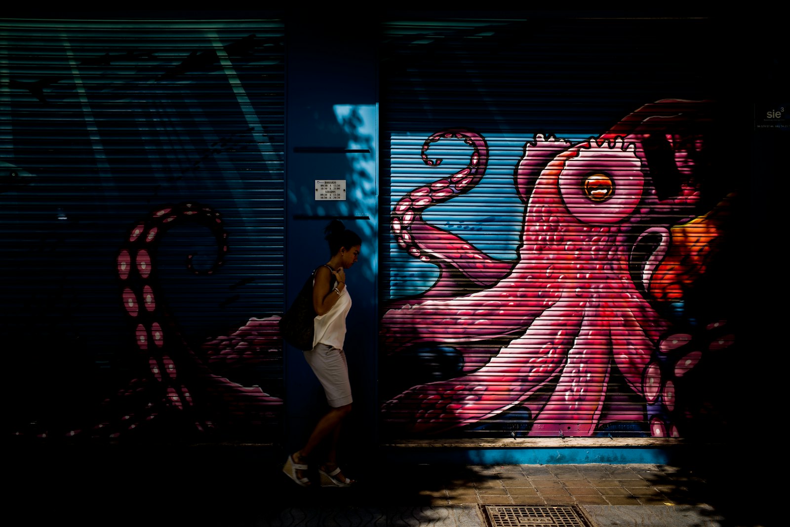 Leica M10-P sample photo. Woman standing beside octopus photography