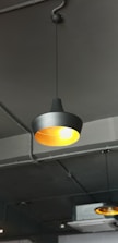two turned-on gray pendant lamps