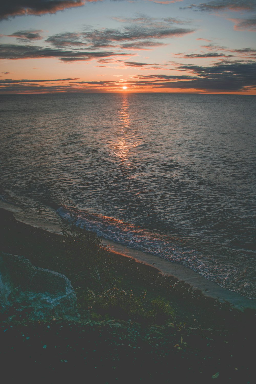 aerial photography of blue sea during sunset