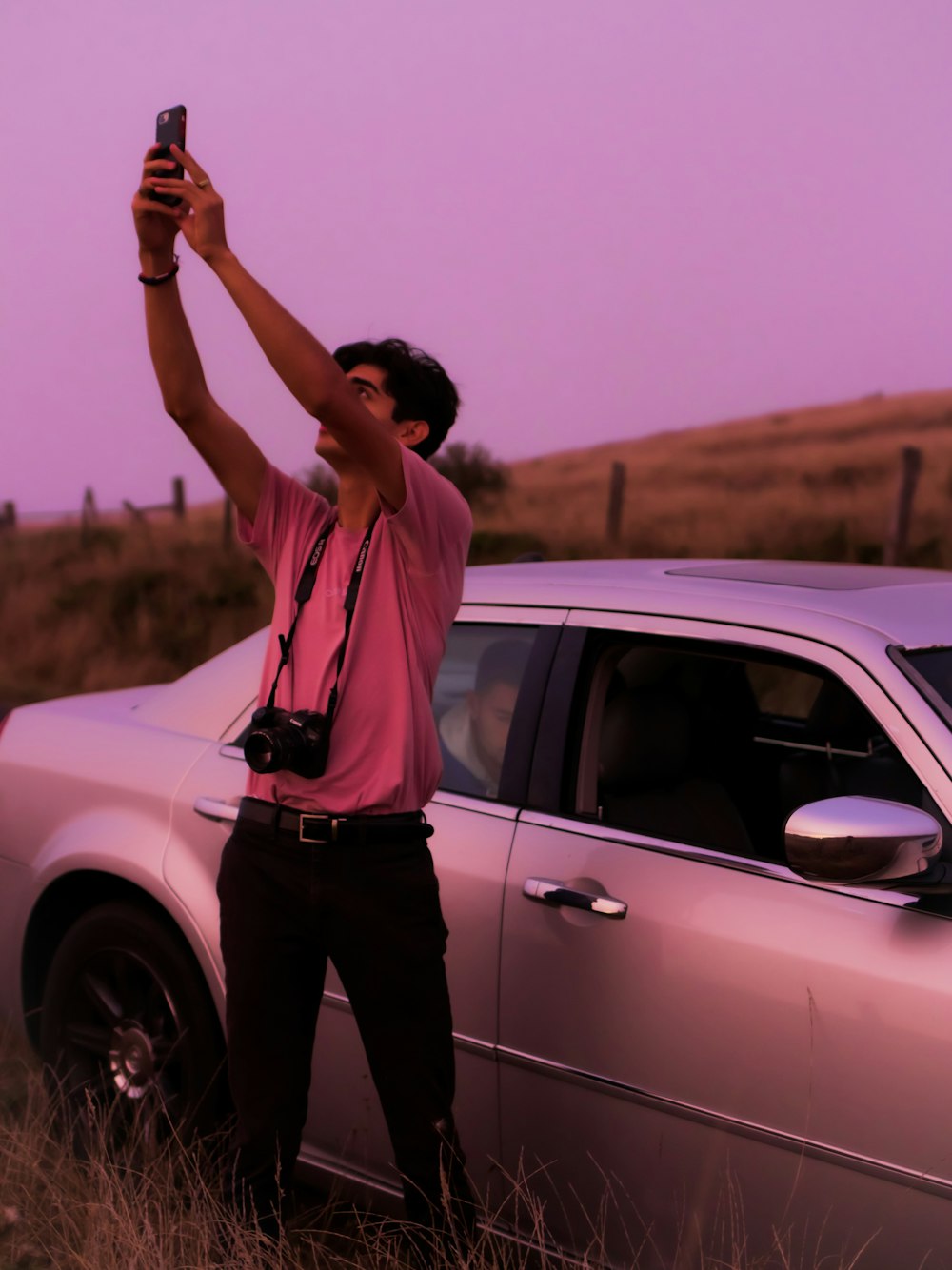 man wears pink crew-neck t-shirt