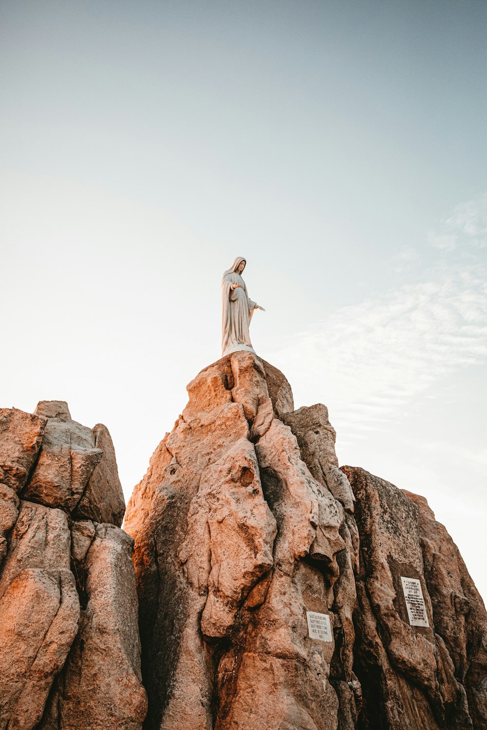 Virgin Mary statue on rock boulder