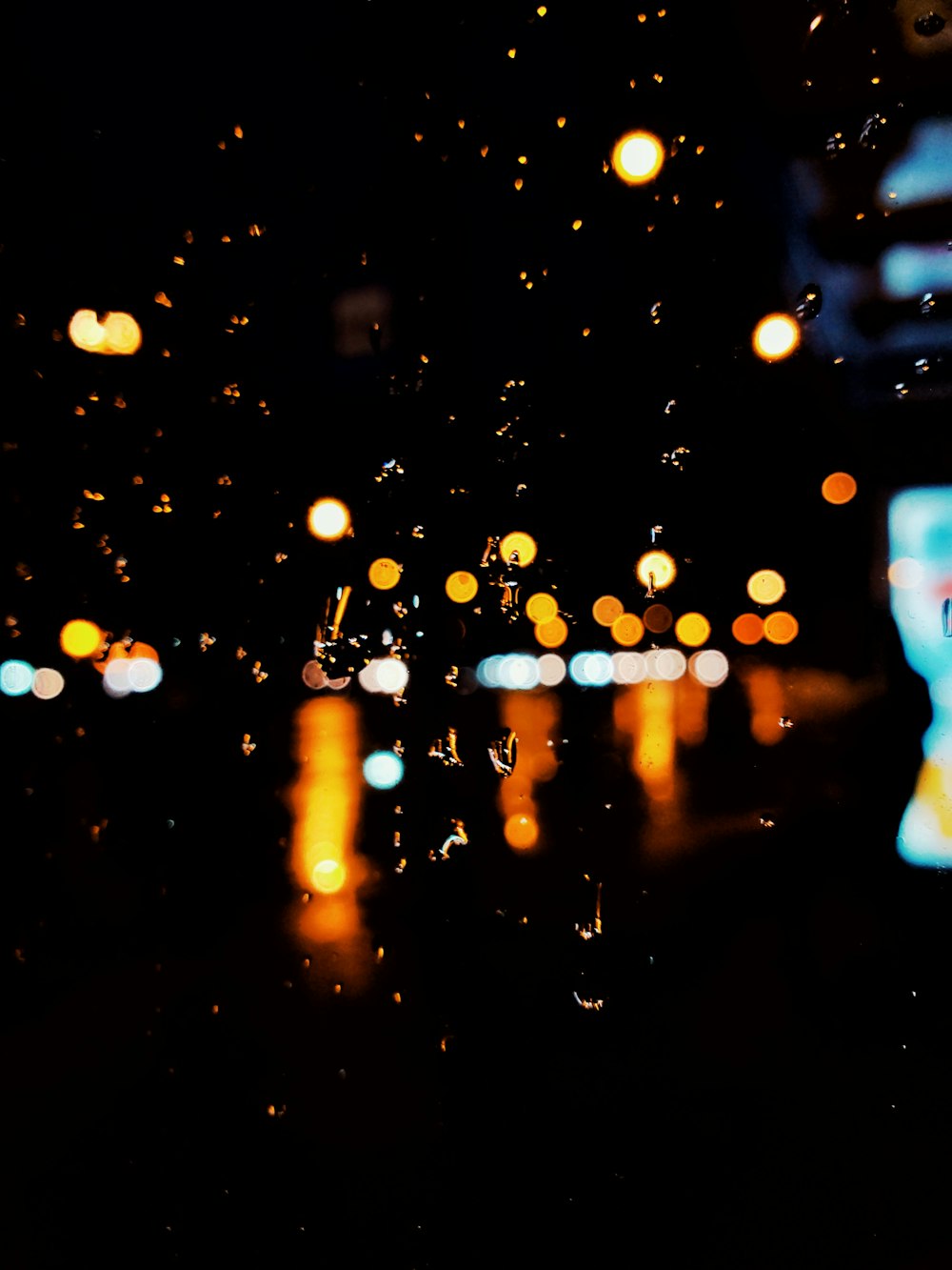 a blurry photo of a city street at night