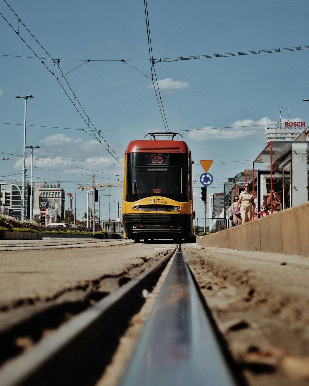 red and yellow train on rail