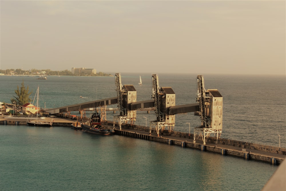 gray concrete buildings over the sea