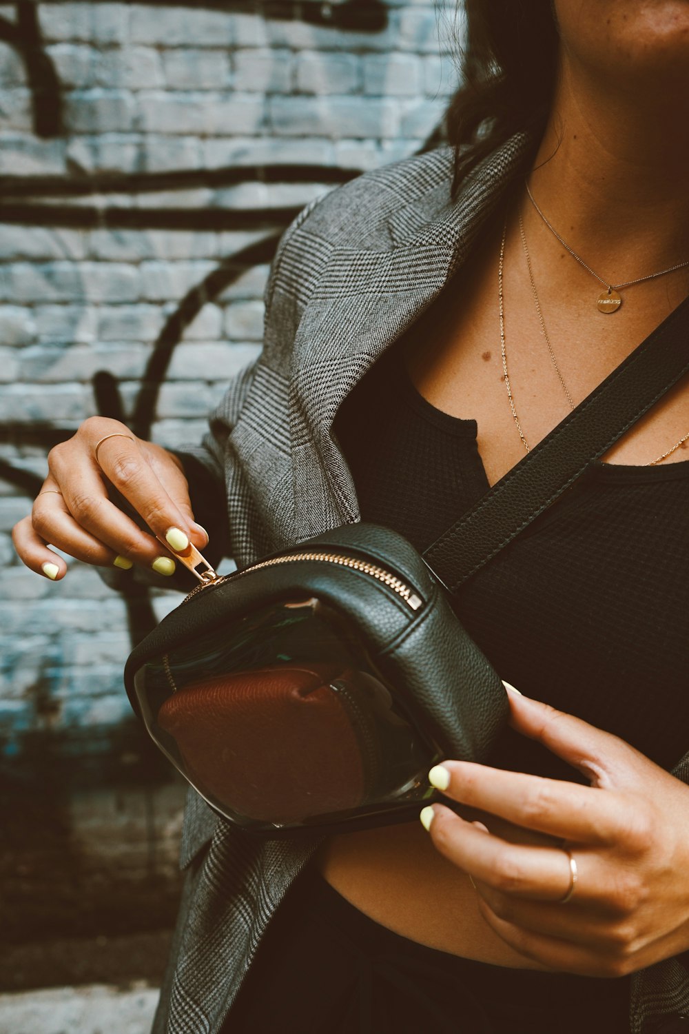 woman with crossed body bag standing