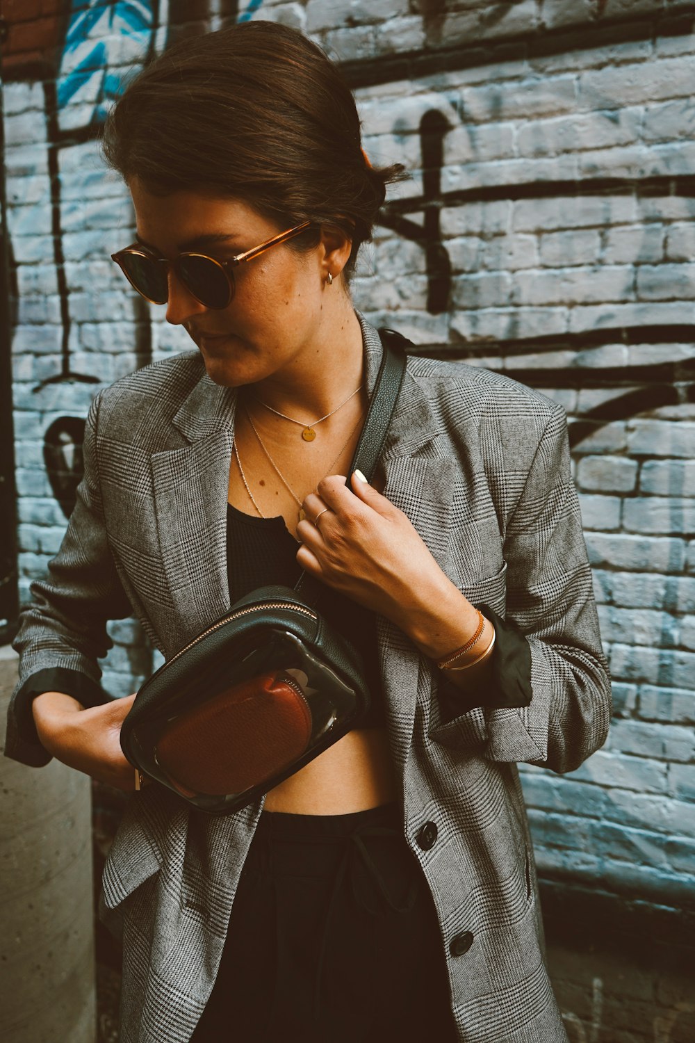 woman wearing gray and black coat