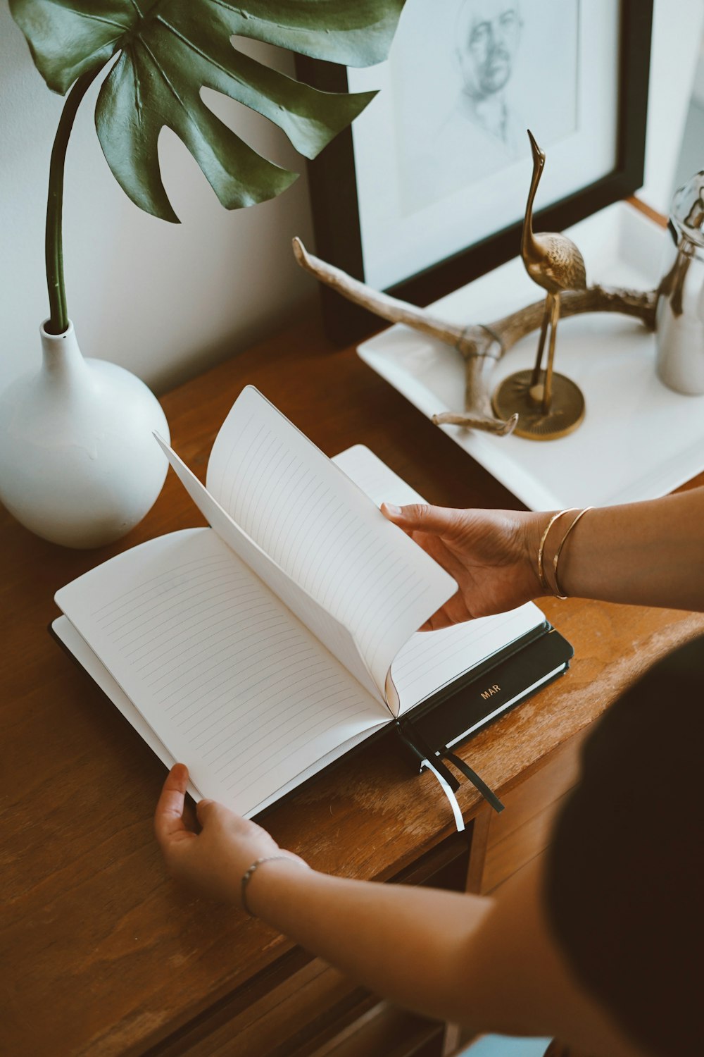 person opening notebook