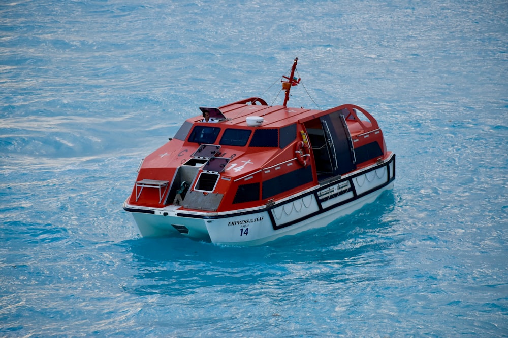 red and white motorboat