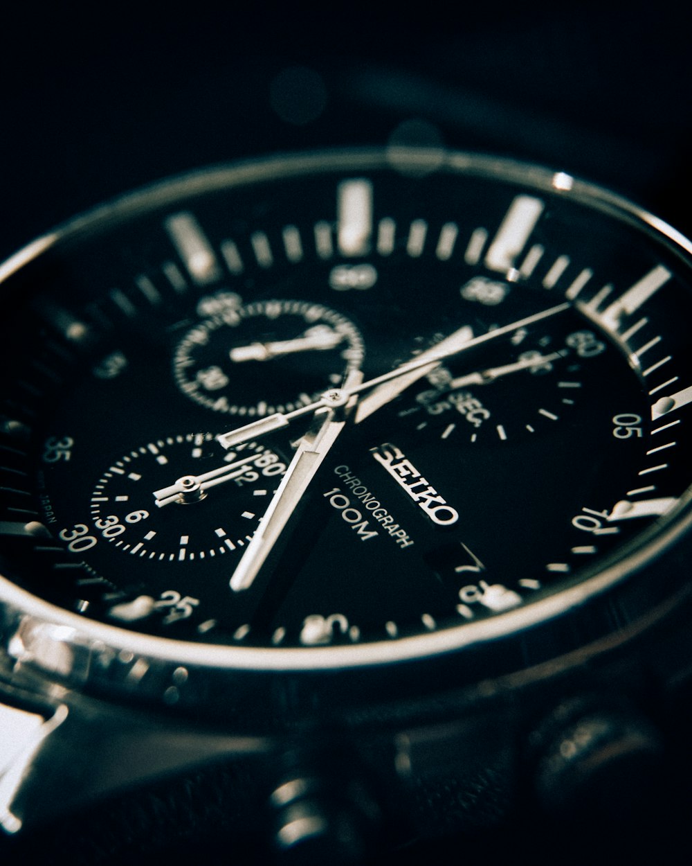 round silver-colored Seiko chronograph watch