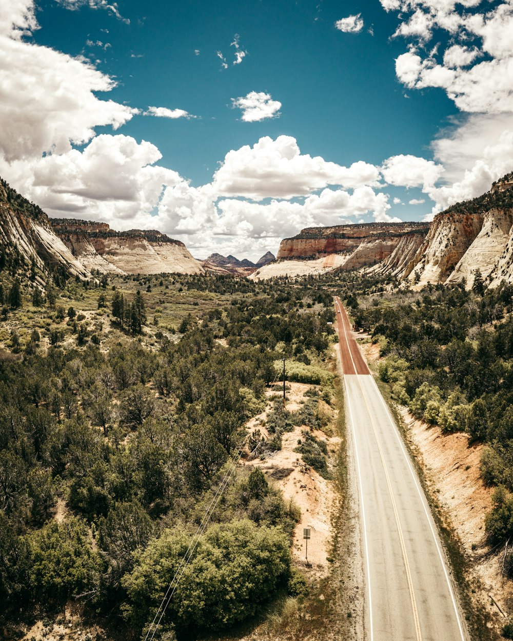 gray road under blue sky