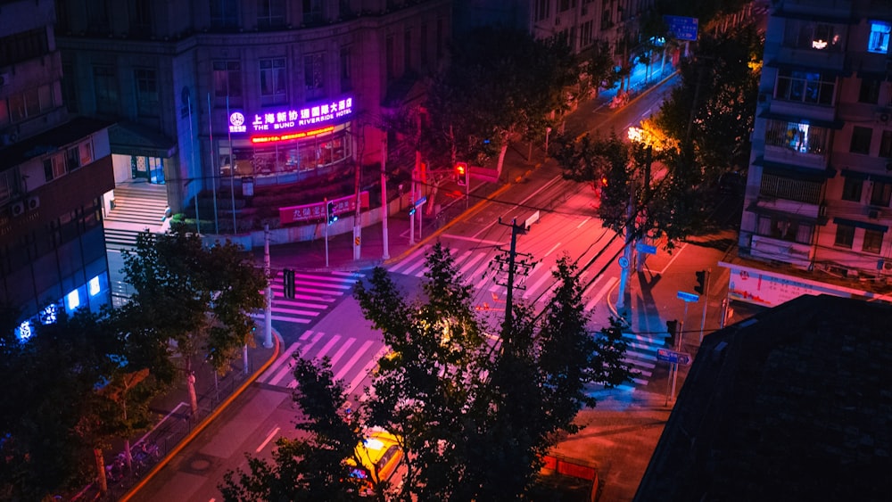 a city street at night with traffic lights