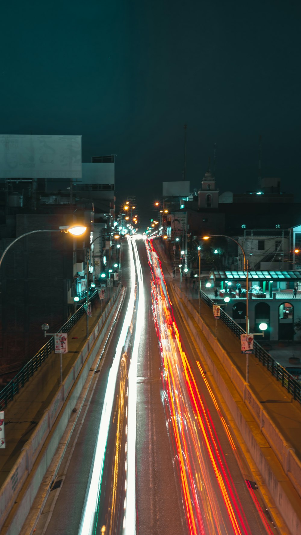 time lapse photo of cars passing by during nighttime