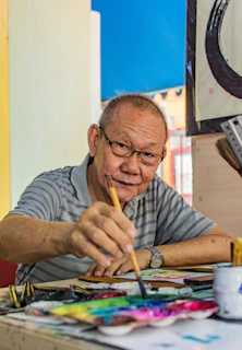 man painting on table