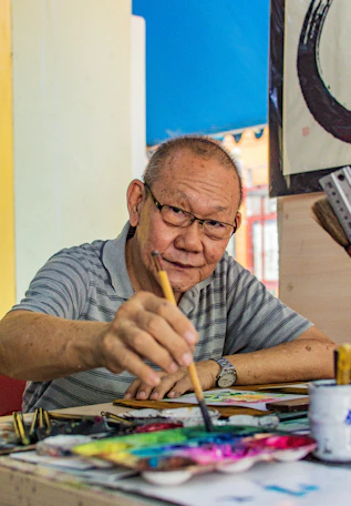 man painting on table