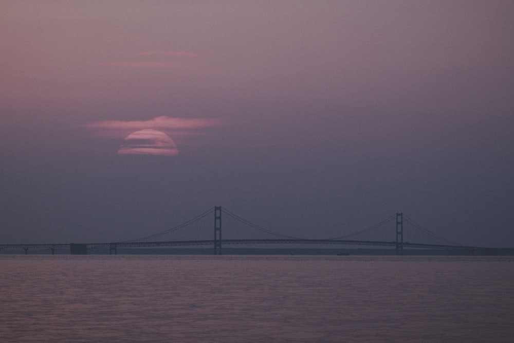 concrete bridge across sea at daytime