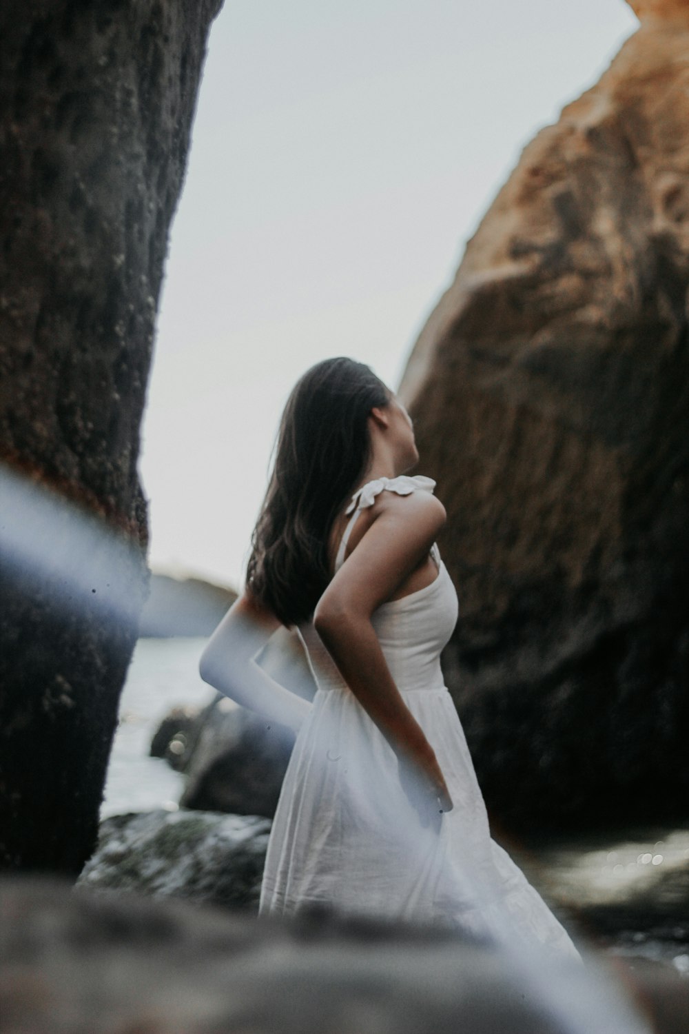 woman standing near rocks at daytime