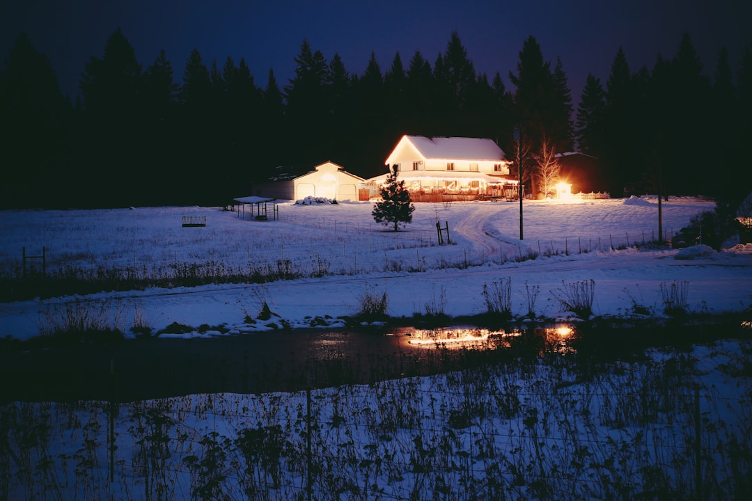 white 1-storey house surrounded by snow