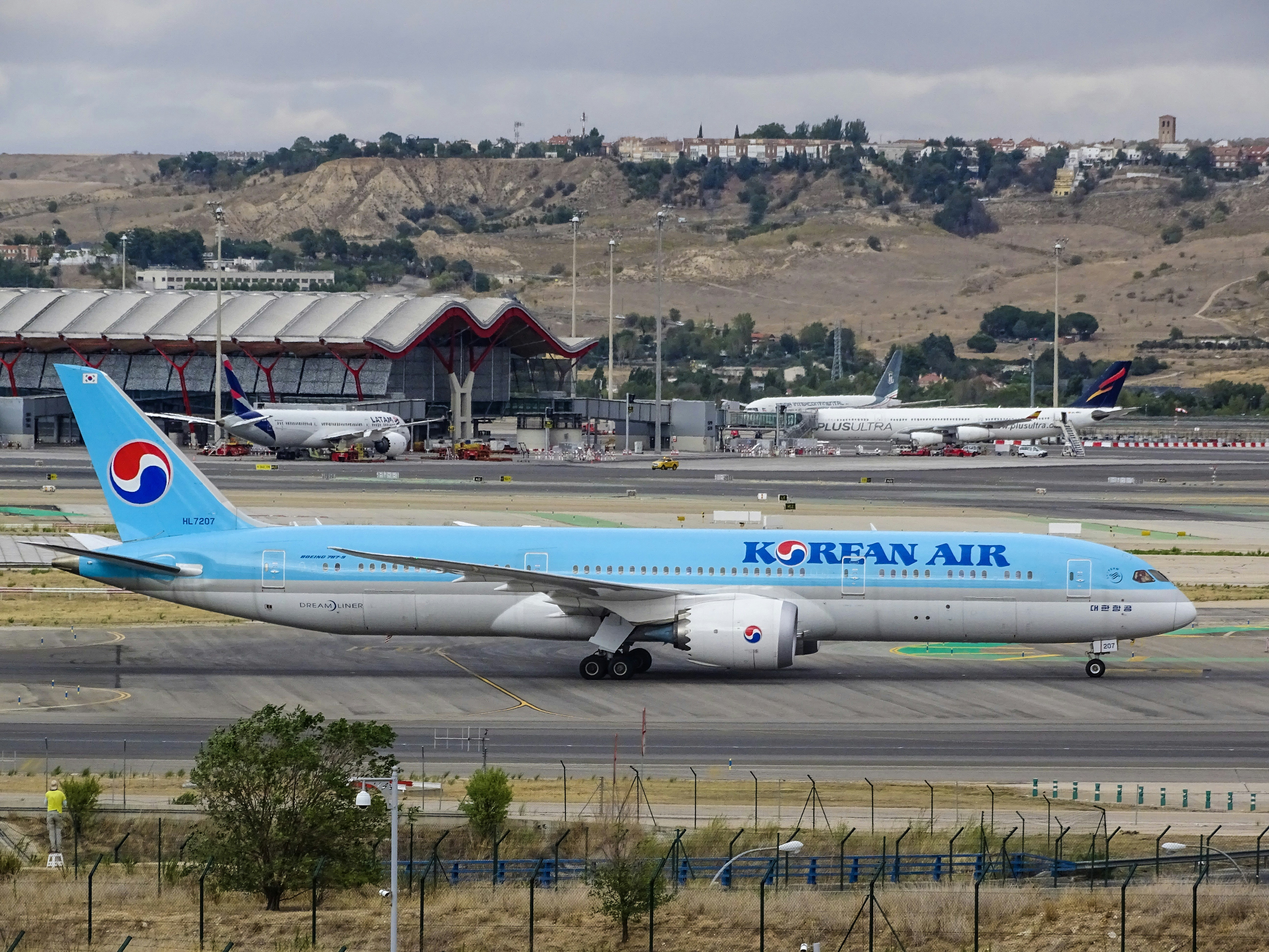 blue Korean Air airplane on runway, 